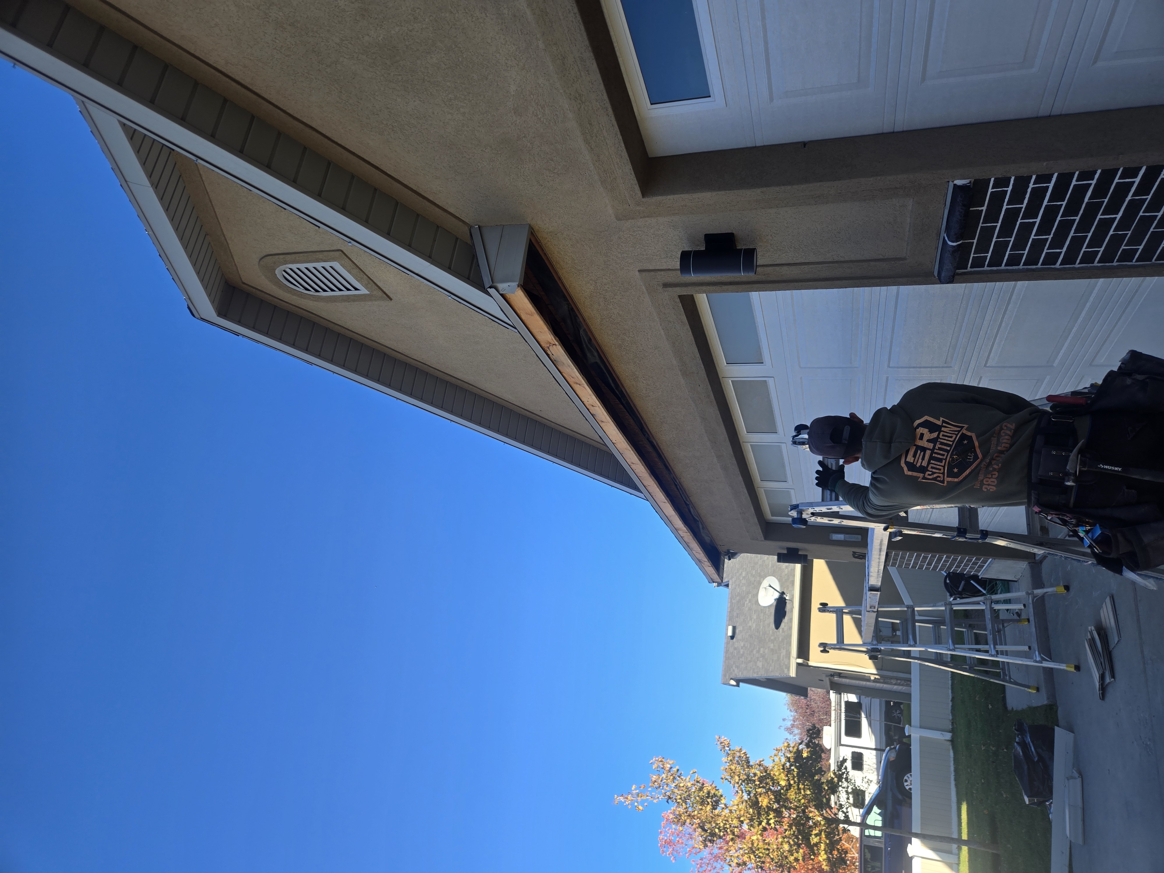 Fascia and soffit repair above a garage